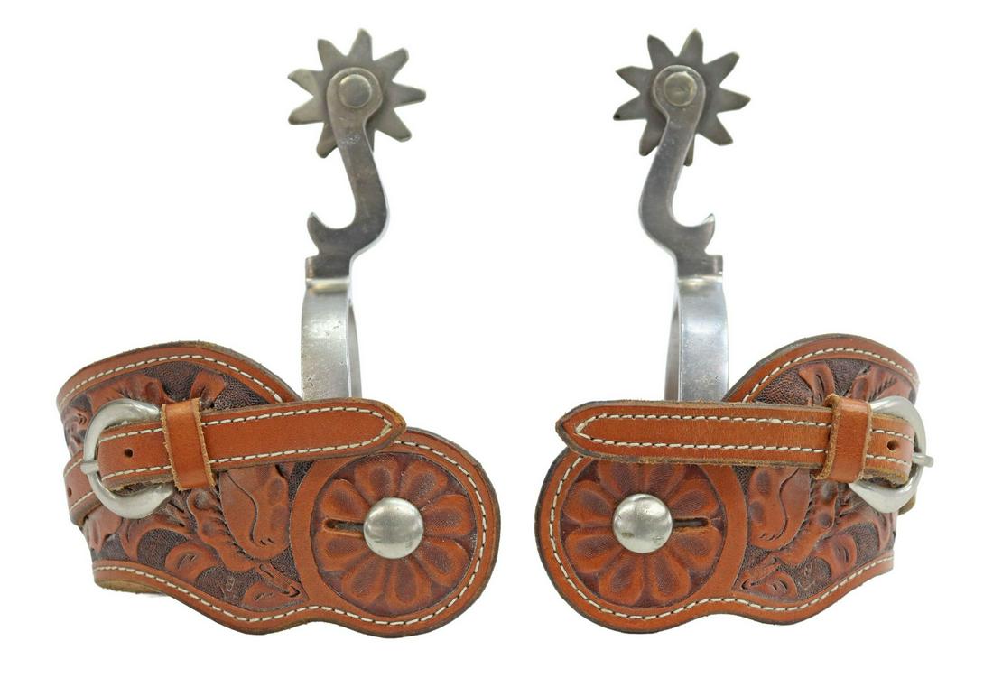 (PAIR) CROCKETT DOUBLE MOUNT BOTTLE OPENER SPURS: (pair) Crockett double mount stainless steel bottle opener spurs, "Crockett" stamped on heelband edge, 9 point 1.75" rowels, tooled leather buckle straps, inside yoke: approx 3.5"w, 3"d Start Price: $