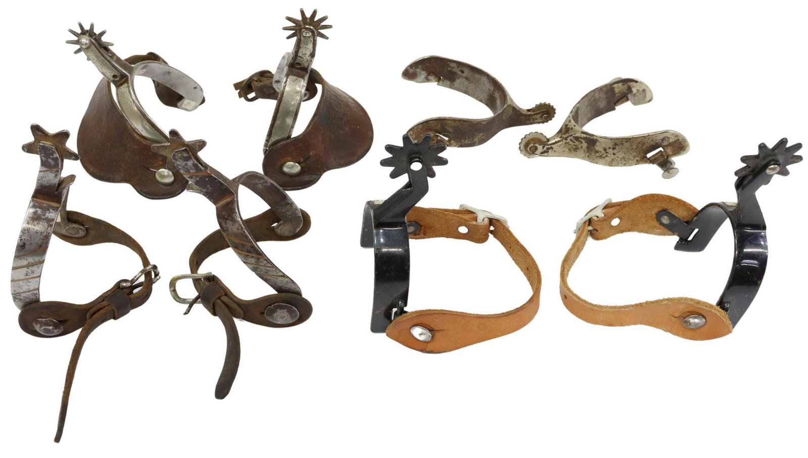 (4 PAIRS) VINTAGE COWBOY SPURS: (lot of 4 pairs) Cowboy spurs, including: (1) Vintage Kyle Pettigrew KP mark in circle pair, bull riding spurs, worn chrome, 1" rowels; (1) black steel, marked at the swing arm CR for Crockett Renalde