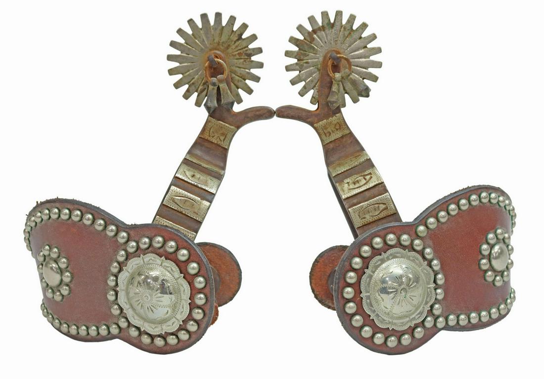 (PAIR) COWBOY SPURS, CONCHO LEATHERS, NICKEL: (pair) Cowboy spurs, each with nickel decoration, 2 1/8" rowels with 20 points, jingle bobs, concho leathers by John Clark, Shakopee, Minnesota, yoke: approx 3.25"w, 3.5"d Start Price: $80.00