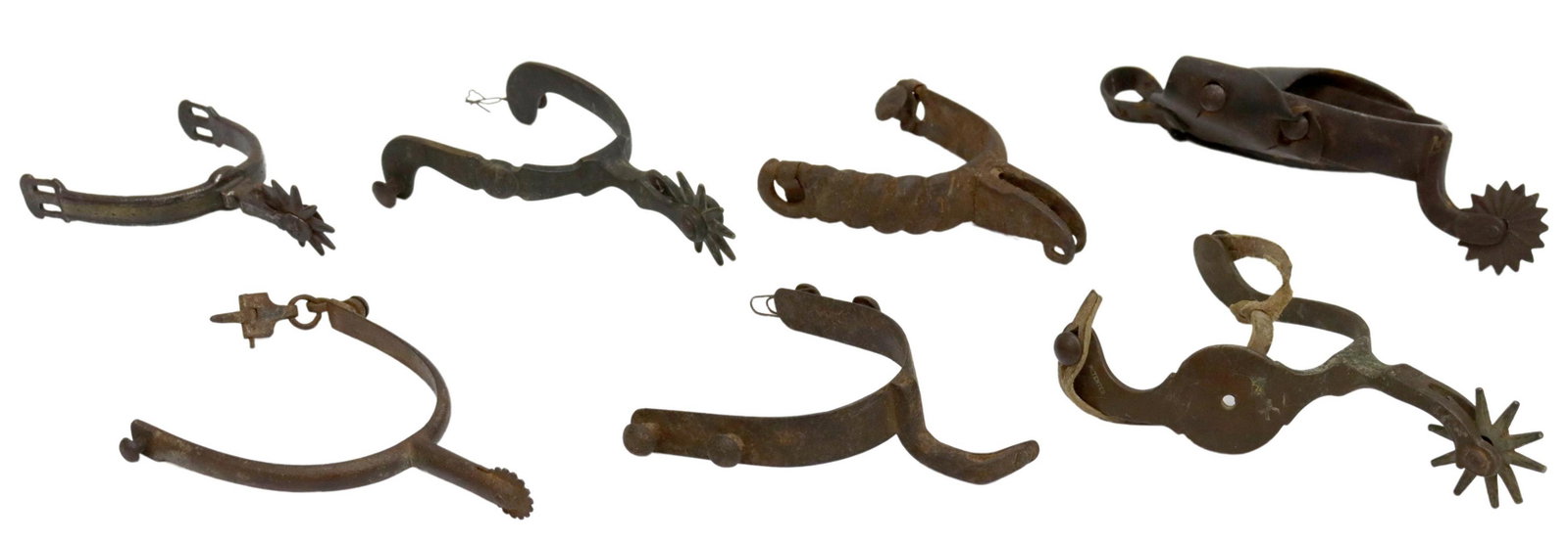 (7) SINGLE TEXAS SPURS FOR DISPLAY: (lot of 7) Single Texas spurs, including: (1) marked "Hercules Bronze" and Patent over Star, Buerman star by North & Judd , (1) foliate engraved at one side of yoke, ten point 1.75" rowel; (1) appears