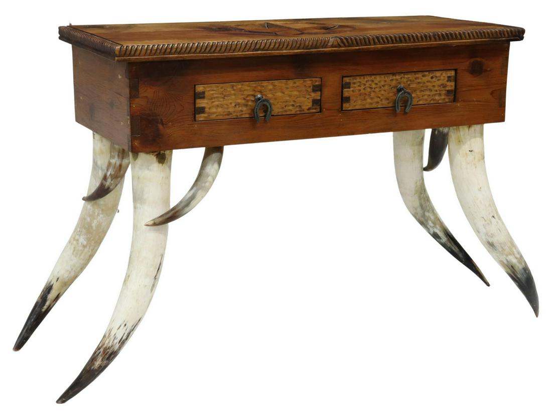 WESTERN STEER HORN & CARVED PINE CONSOLE TABLE: Western style pine console table, Mexico, having rectangular top with carved star and rope twist border, over two drawers, with iron horseshoe-form pulls, exposed dovetail joinery, rising on steer hor