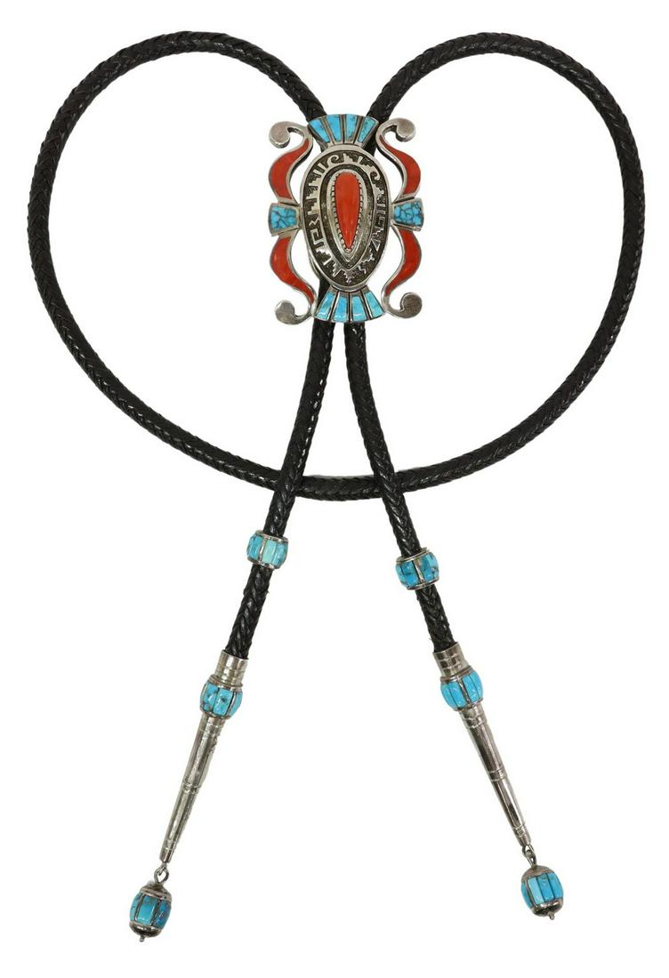 MICHAEL PERRY NAVAJO SILVER TURQUOISE & CORAL BOLO: Exceptional Native American sterling silver bolo tie, signed MP (Michael Perry, Navajo, b.1975), shaped overlay bolo ornament with inlays of turquoise and red coral, silver bolo tips and sleeves accen