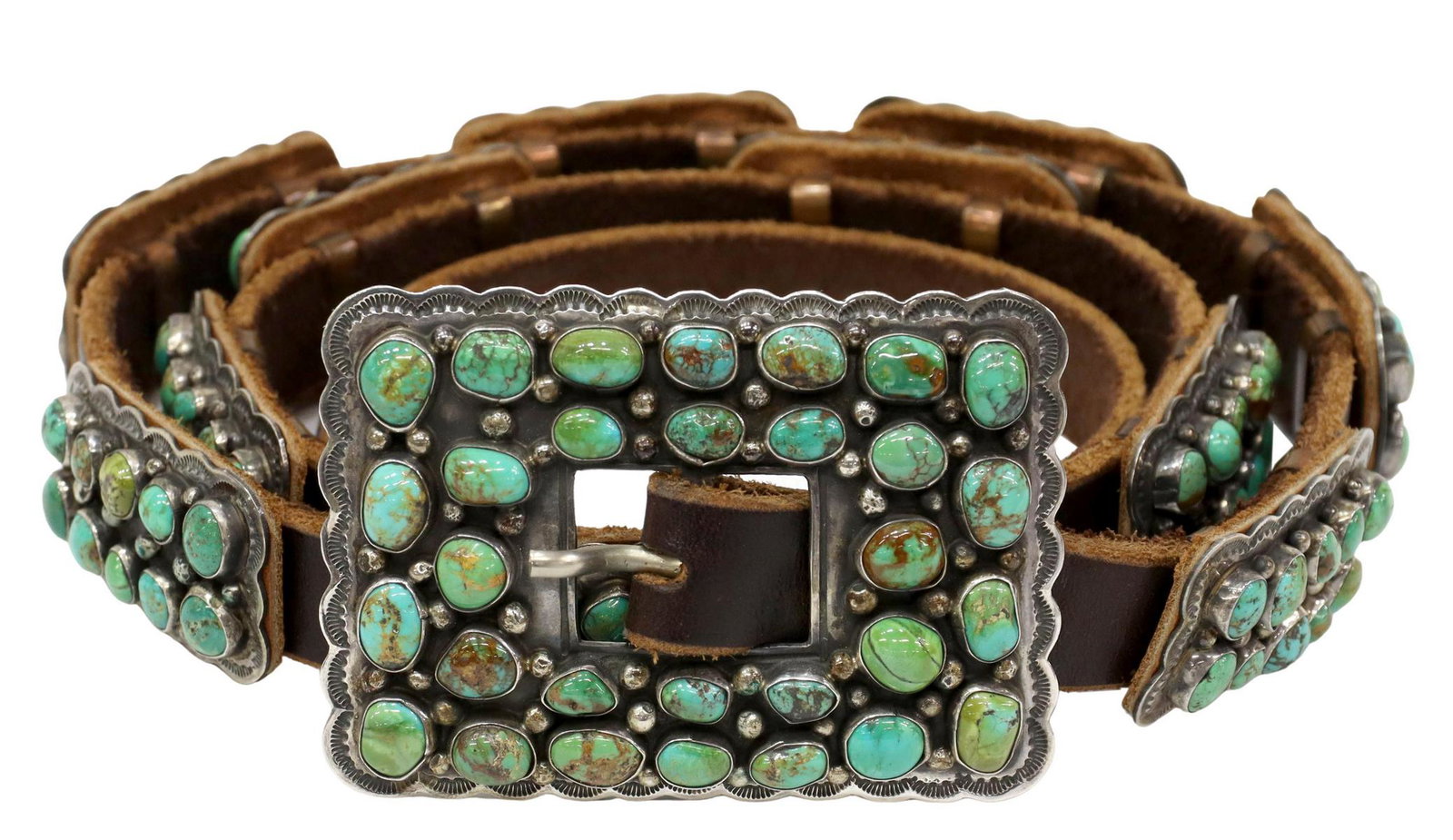 DANIEL MARTINEZ NAVAJO TURQUOISE CONCHO BELT: Native American sterling silver concho belt, Daniel Martinez (Navajo, 20th c.), eleven conchos and belt buckle, all set with Emerald Valley turquoise cabochons, on a brown leather belt, no holes punch