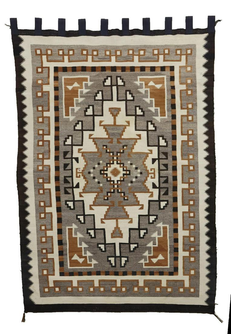 NAVAJO TWO GRAY HILLS RUG, 6'4.5" X 3'9": Navajo hand-woven wool rug, two grey hills pattern, c.1950s, fitted with cloth loops for hanging, approx 6'4.5"l, 3'9"w Start Price: $600.00