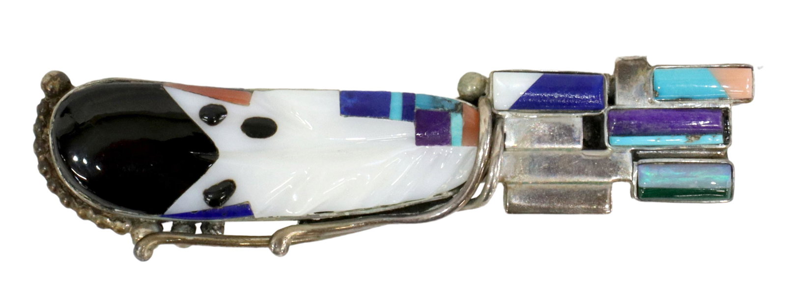 VERONICA NASTACIO ZUNI MULTI-STONE INLAY BROOCH: Native American silver (content unknown) brooch, Veronica Nastacio Poblano (Zuni, 20th c.), in the form of a feather, white shell inlaid with jet, turquoise, lapis lazuli, coral, sugilite, opal, etc.,