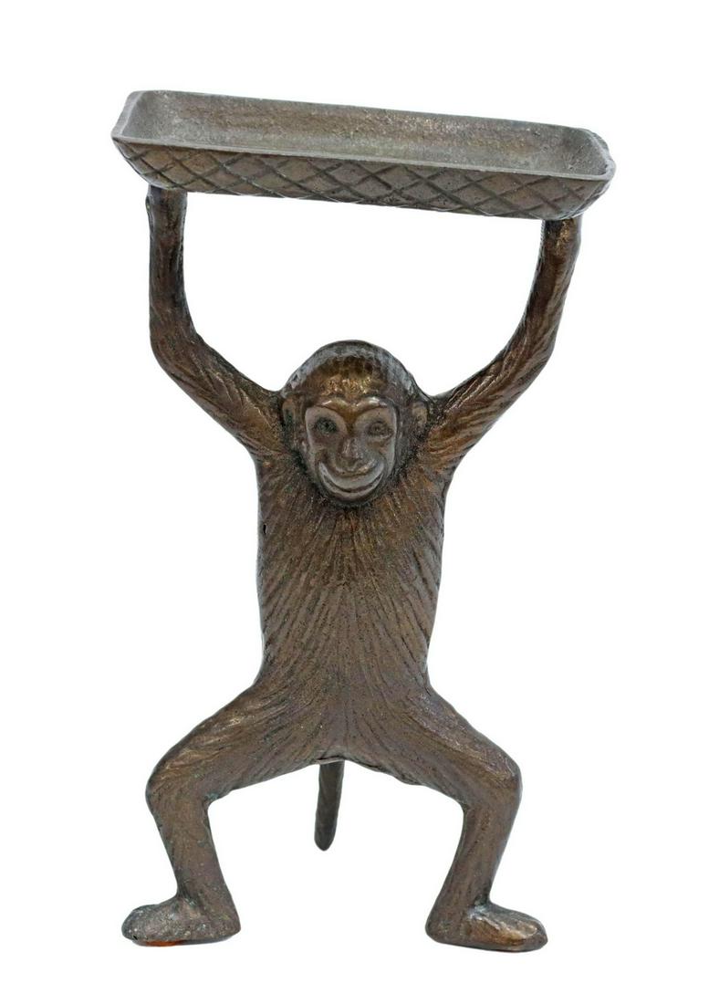 BRONZE PATINA METAL MONKEY CARD HOLDER TRAY: Cast metal card holder in a bronze patina, late 20th c., rectangular tray held aloft by a monkey, approx 7"h, 4 1/8"w, 2 5/8"d, 1lbs Start Price: $80.00