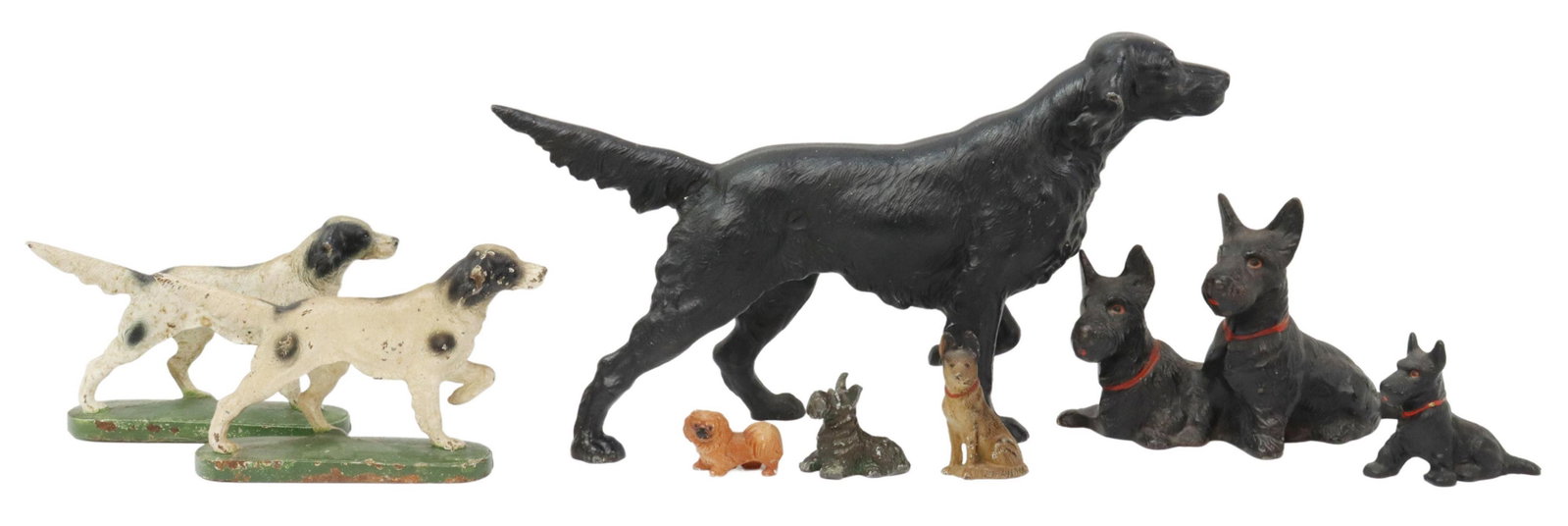 (8) CAST IRON DOG FIGURES & DOORSTOPS, HUBLEY: (lot of 8) Painted cast iron dog figures and doorstops, early 20th c., including: (pair) black and white pointers, rising on a green oblong base; (1) black hunting dog; (1) joined pair of Scotties wit