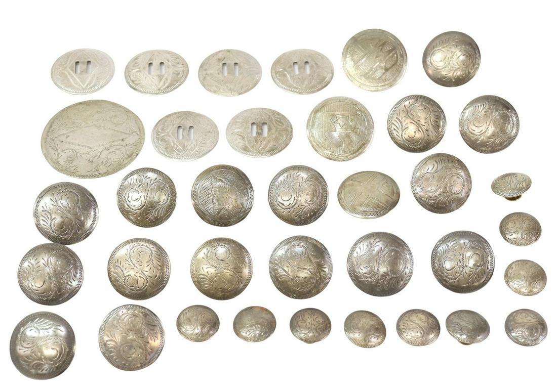 (36) SILVER-TONE METAL SADDLE CONCHOS & BUTTONS: (lot of 36) Silver-tone metal concho buttons, including: (15) large buttons, for saddles or other leather goods, hammered disc with stamped s-scroll design, screw back, approx 1.5"diam, (10) small but