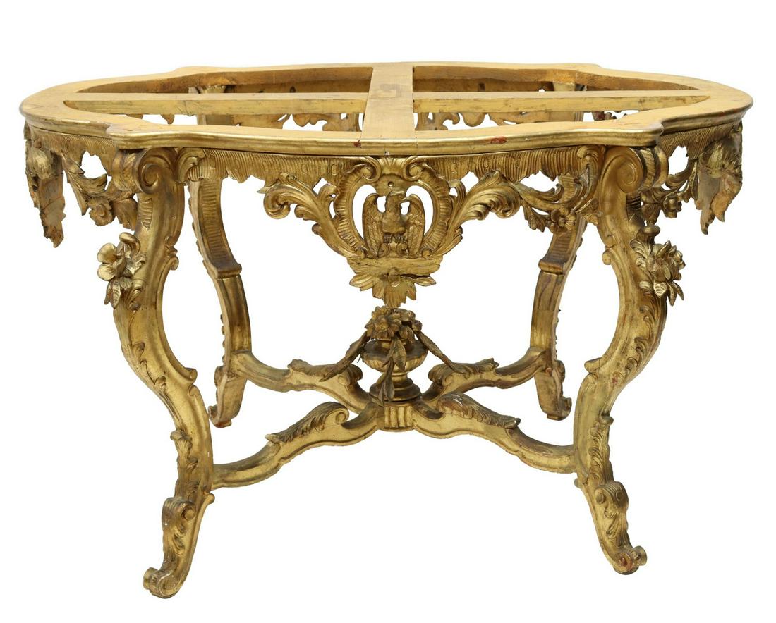 LOUIS XV STYLE GILTWOOD TABLE BASE: Louis XV style giltwood table base, having shaped top, over heavily carved apron with foliate and eagle motifs, stretcher-joined legs with center floral finial, rising on scrolled feet, approx 31&rdqu