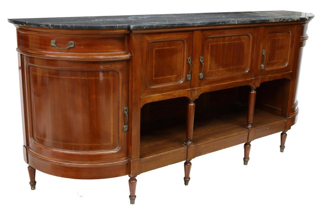 LOUIS XVI STYLE MARBLE-TOP MAHOGANY SIDEBOARD: French Louis XVI style mahogany sideboard, early 20th c., shaped marble top, three center cabinet doors over open niche, turned supports, flanked on both sides by single drawer and curved cabinet door