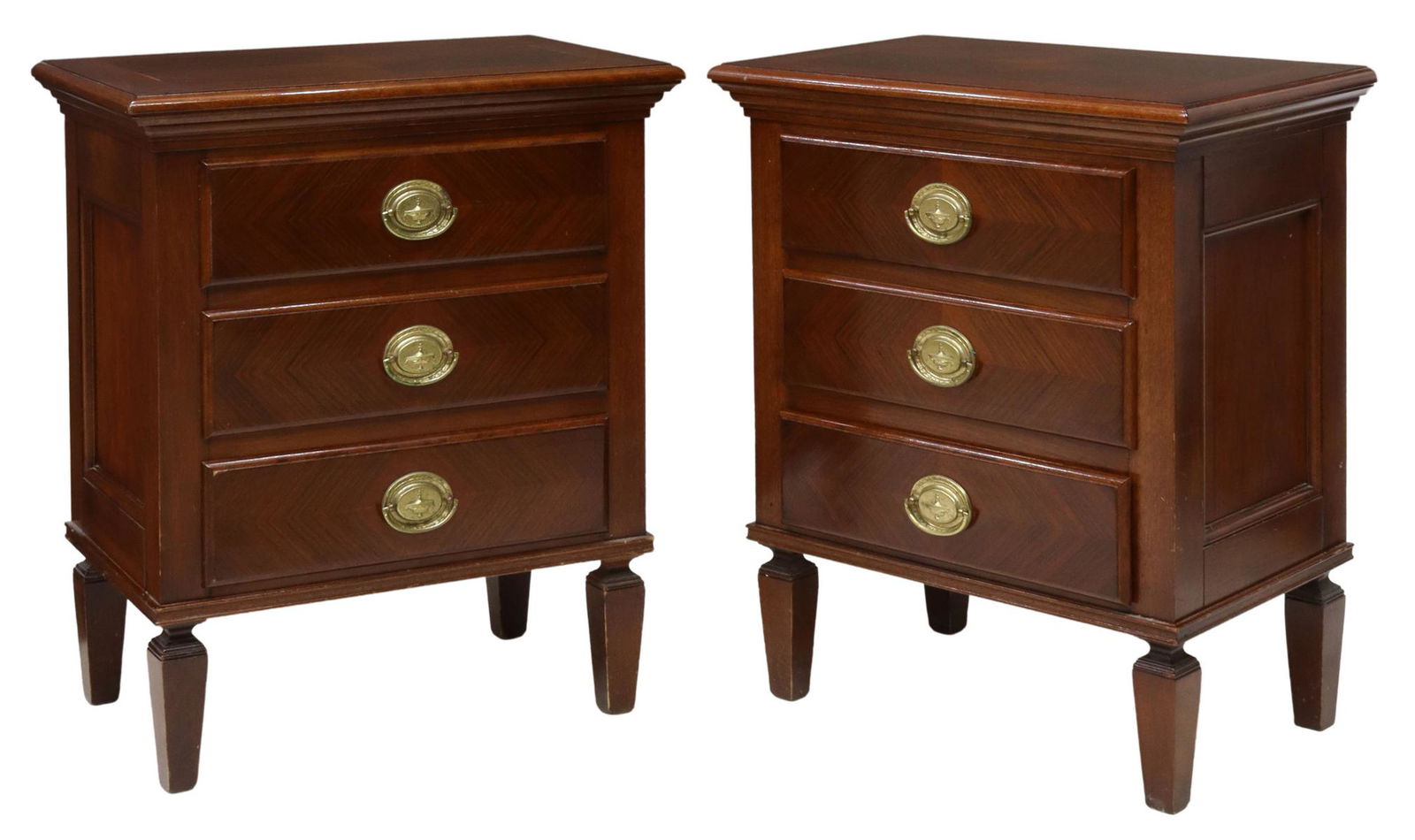 (2) MAHOGANY THREE-DRAWER NIGHTSTANDS: (lot of 2) Mahogany beside tables, 20th c., having rectangular top, over case fitted with three drawers, gilt metal ring pulls, rising on tapered square legs, approx 28.5"h, 24.25"w, 15"d Start Price: