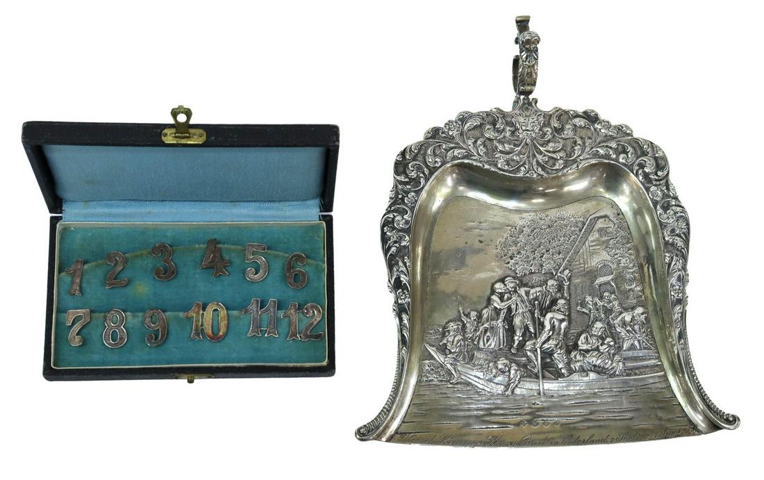 (13) DUTCH 800 SILVER GLASS NUMBERS & CRUMB TRAY: (lot of 13) Dutch 800 silver, including: (12) wine glass/ table numbers, numbers one through twelve, with clip backs, housed in fitted box, box: approx 7/8"h, 4.5"w, 2 5/8"d, (1) crumb tray, Zaanlands
