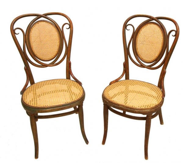 PAIR ANTIQUE THONET AUSTRIA BENTWOOD SIDE CHAIRS: (pair) Thonet bentwood side chairs, late 19th/early 20th c., each showing remnants of a painted finish, later caned seat and back rest, signed Thonet, Austria, one with partial paper tag remaining, 37