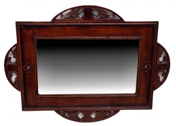 ENGLISH EDWARDIAN CARVED OAK WALL MIRROR: Edwardian wall mirror, the carved oak frame having pierced accents enclosing a beveled plate, 28.75"h, 39"w, 20lbs (e16061)