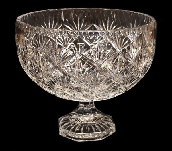 LARGE CUT CRYSTAL CENTER BOWL ON A PEDESTAL FOOT: Large center bowl, the bowl finely cut in a crosshatch/star pattern, raised on a pedestal foot, 9.5"h, 11"d, 11lbs