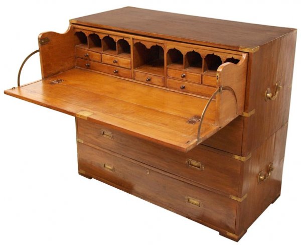ANTIQUE BRITISH COLONIAL CAMPAIGN SECRETARY CHEST: British Colonial teakwood campaign chest in two-parts, 19th c., the upper stack of two drawers opening to reveal a secretary fitted with drawers and cubby slots, the lower section housing two long dra