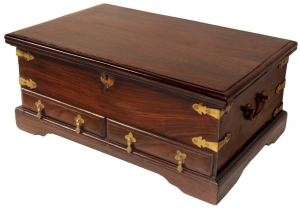 BRITISH COLONIAL BRASS BOUND ROSEWOOD STORAGE BOX: British Colonial brass bound rosewood storage box, 19th c., lockable top with brass strap hinges and fitted interior, over two exterior drawers, on a bracket base, retaining side carrying handles, res