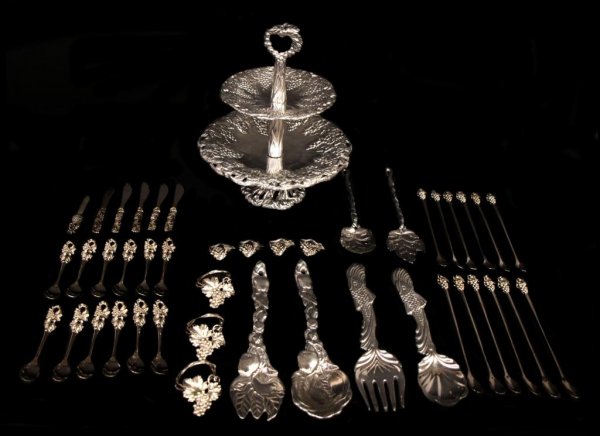 HUGE GROUP ARTHUR COURT & OTHER TABLEWARE: (lot of 44) Arthur Court and style tableware comprising: (1) two-tiered Grape design dessert tray, Arthur Court mark and 1990 date underfoot, 12"h, 11.5"d; (12) Grape motif spoons, 5.25"l; (4) grape d