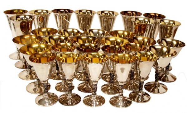 SET VALERO SPAIN GILT WASH SILVER PLATE GOBLETS: (lot of 31) Collection of silver plate goblets, by Valero of Spain, the stems in a grape vine motif, bowls with gilt wash, comprising: (10) water goblets, 7"h, 3.5"d; (12) wine or champagne goblets, 5