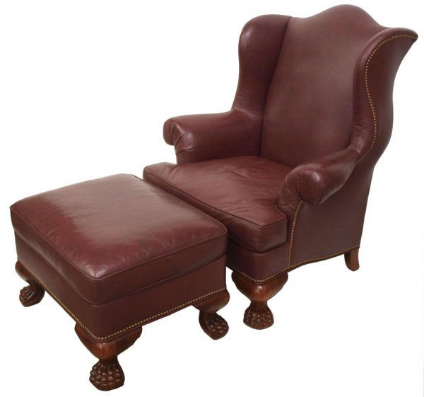 HICKORY LEATHER PAW FOOT WINGBACK CHAIR & OTTOMAN: (lot of 2) "Hickory Chair Leather" wingback chair raised on carved paw feet (front), the oversized chair with contoured design, upholstered in burgundy leather with brass tack accents and loose cushio