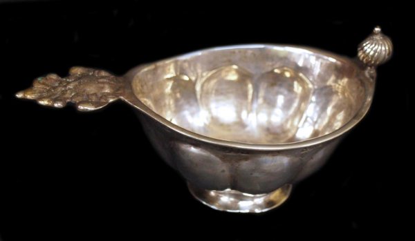 18TH C SWEDISH SILVER VESSEL, JOHAN SODERAHL: Unusual Swedish silver footed vessel, c.1778, with wide melon rib design, incised under repousse fleur de lis and cherub mask handle '1778' along with the inscription 'M.A.S. L.A.D.', hallmarks along 