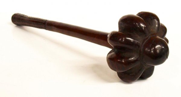 19TH C. FIJIAN CARVED HARDWOOD THROWING CLUB: Fijian carved hardwood throwing club, 19th c., the head of ribbed bulbous form, the handle with incised carving, split in wood at head, 14"l, 4.5"d, 1lb