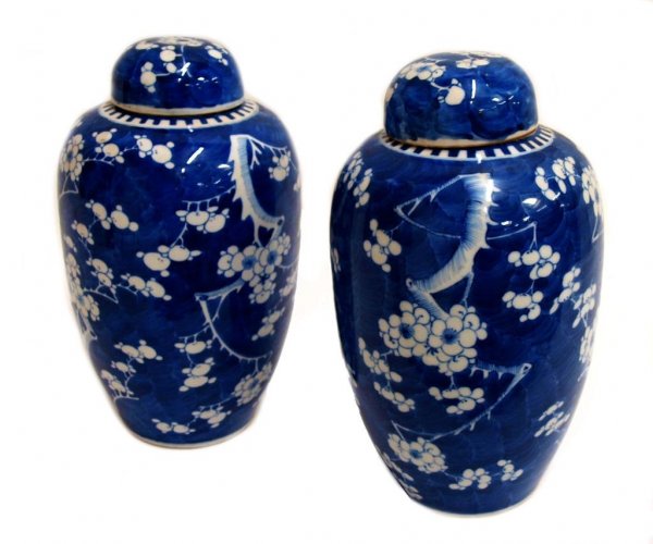 PAIR CHINESE EXPORT BLUE & WHITE PORCELAIN VASES: (pair) Chinese export blue and white porcelain ginger jars in an all over cherry blossom pattern, remnants of red wax seals at bases and interior of lids, no loss noted under blacklight, 14"h, 8"d; 8l