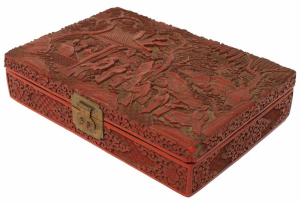 LARGE CHINESE CINNABAR BOX, EIGHT IMMORTALS: Chinese Cinnabar lacquer box, elaborate figural and foliate carving depicting the Eight Immortals, black lacquer interior, damage at corners, 2.75"h, 12.75"w, 9"d, 4lbs