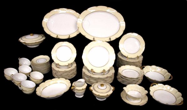 THEODORE HAVILAND LIMOGES PORCELAIN DNNER SERVICE: (lot of 73) Porcelain dinner service by Theodore Haviland, Limoges France in the 'Ivory' pattern having heavily gilt details, comprising: (8) dinner plates, 9.5"d; (12) salad plates, 8.75"d; (12) brea