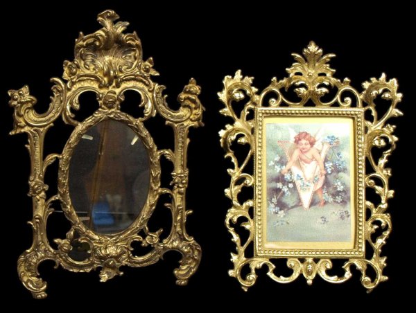 (2) FANCY CAST BRASS ROCOCO STYLE PICTURE FRAMES: (lot of 2) Cast brass easel picture or mirror frames in the Rococo style each with glass insert, one in ornate scroll and shell form having an oval opening 5.5"h, 4"w, overall: 14"h, 9"w; the other wi