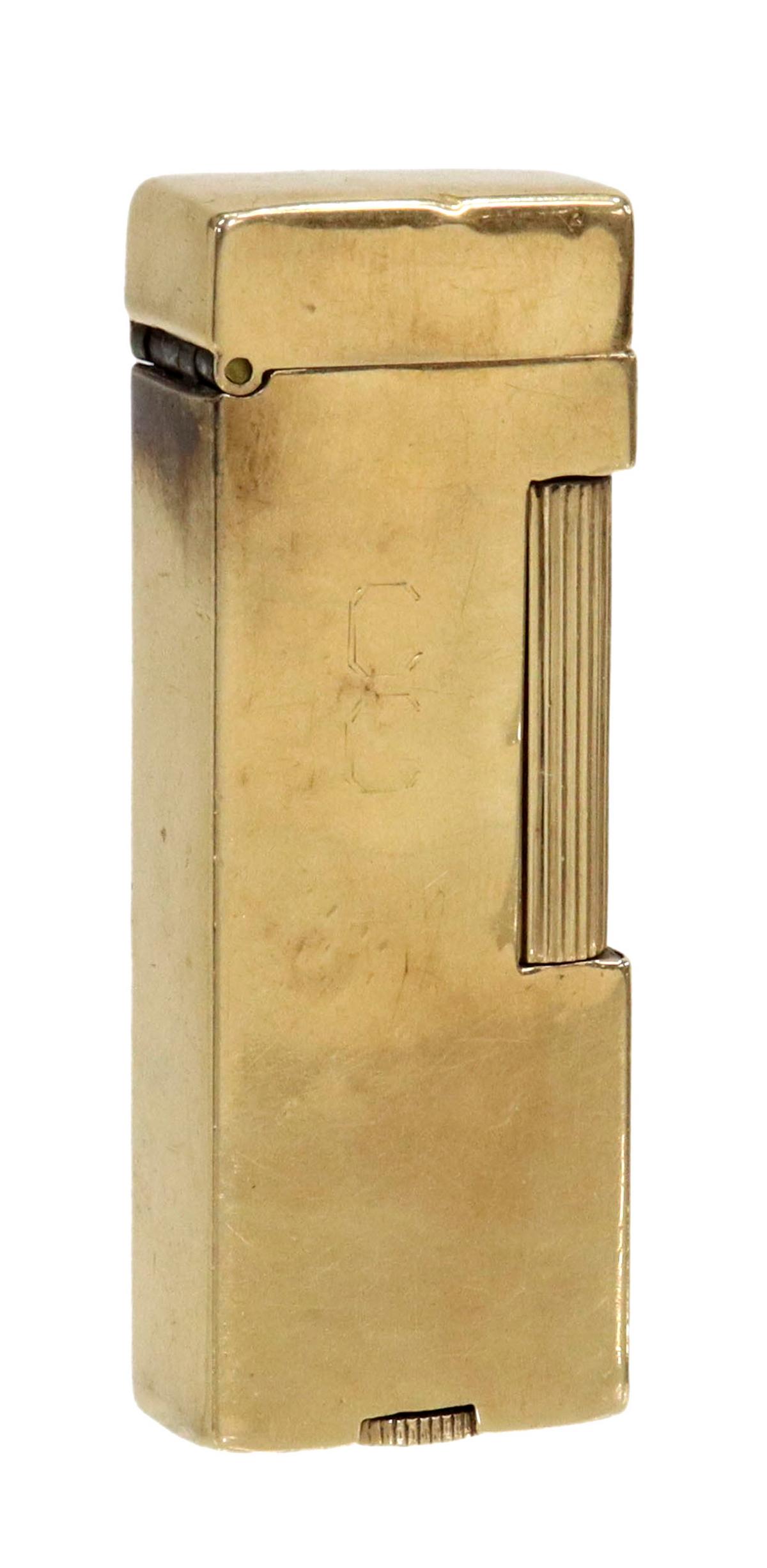 GENT'S DUNHILL 14KT GOLD CASED ROLLAGAS LIGHTER: Vintage gent's Dunhill 14kt gold cased "Rollagas" lighter, faintly monogrammed CC or CG, approx 2.5"l, 69.2 grams (inclusive of all materials) **Provenance: a Houston, Texas estate** Start Price: $100