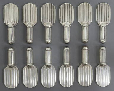 (12) CHRISTOFLE RAQUETTE SILVER PLATE KNIFE RESTS: (lot of 12) French Art Deco silver plate "Raquette" knife rests, designed by Luc Lanel (French, 1893-1965) for Orfevrerie Christofle Paris, approx 3"l, 1"w; 1lbs total (for shipping purposes only)