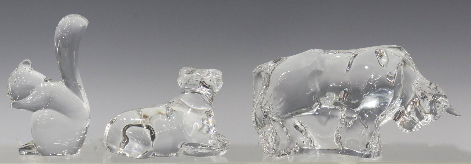 (3) FRENCH BACCARAT CRYSTAL ANIMAL CABINET FIGURES: (lot of 3) French Baccarat crystal animal figures, all with acid-etched marks underfoot, including: (1) squirrel, (1) Zodiac cow/ ox, retailed by Neiman Marcus, (1) bull, largest: approx 3.75"h, 6.5"l