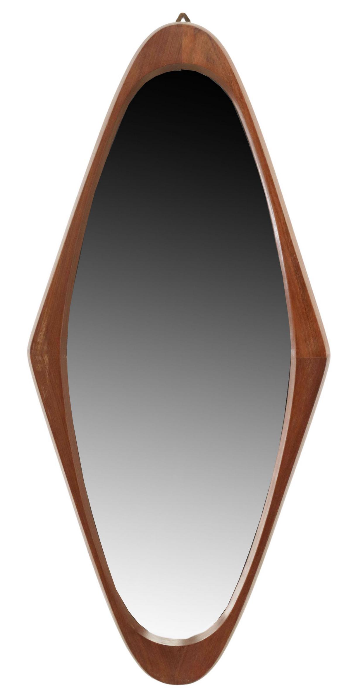 ITALIAN MID-CENTURY MODERN TEAK WALL MIRROR: Italian mid-century modern teak wall mirror, attributed to Franco Campo and Carlo Graffi, c.1960s, shaped teak frame, encasing flat mirror plate, approx 36.5"h, 16.5"w, 7lbs Start Price: $150.00