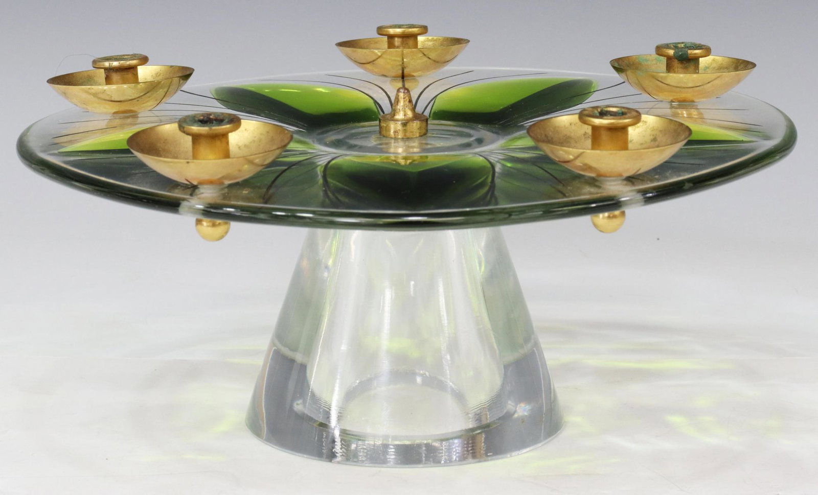 LALIQUE FRANCE ART GLASS FOOTED 5-LT CANDELABRUM: French Lalique art glass candelabrum, 20th c., circular top with green petal-shaped glass and incised accents, five brass bobeches with single candle socket, over conical base, engraved signature unde