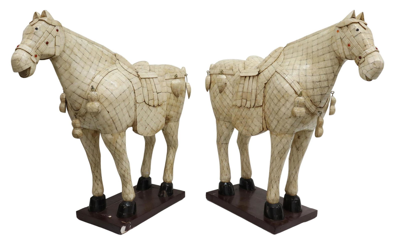(2) CHINESE TANG STYLE TILED BONE HORSES, 30"H: (pair) Large standing Tang style tiled bone horses, having etched decoration, saddle and bridle ornamented with carnelian-colored cabochons and hanging ornaments, horn hooves, rising on painted wood b