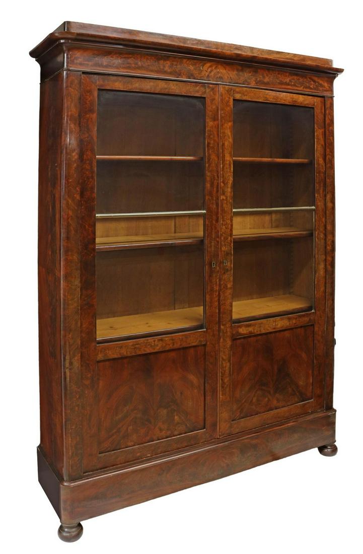 FRENCH LOUIS PHILIPPE PERIOD MAHOGANY BOOKCASE: French Louis Philippe period mahogany bookcase, mid 19th c., molded cornice, two glazed and paneled doors, opening to adjustable-height shelves, rising on bun feet, approx 90"h, 62"w, 17"d Start Price