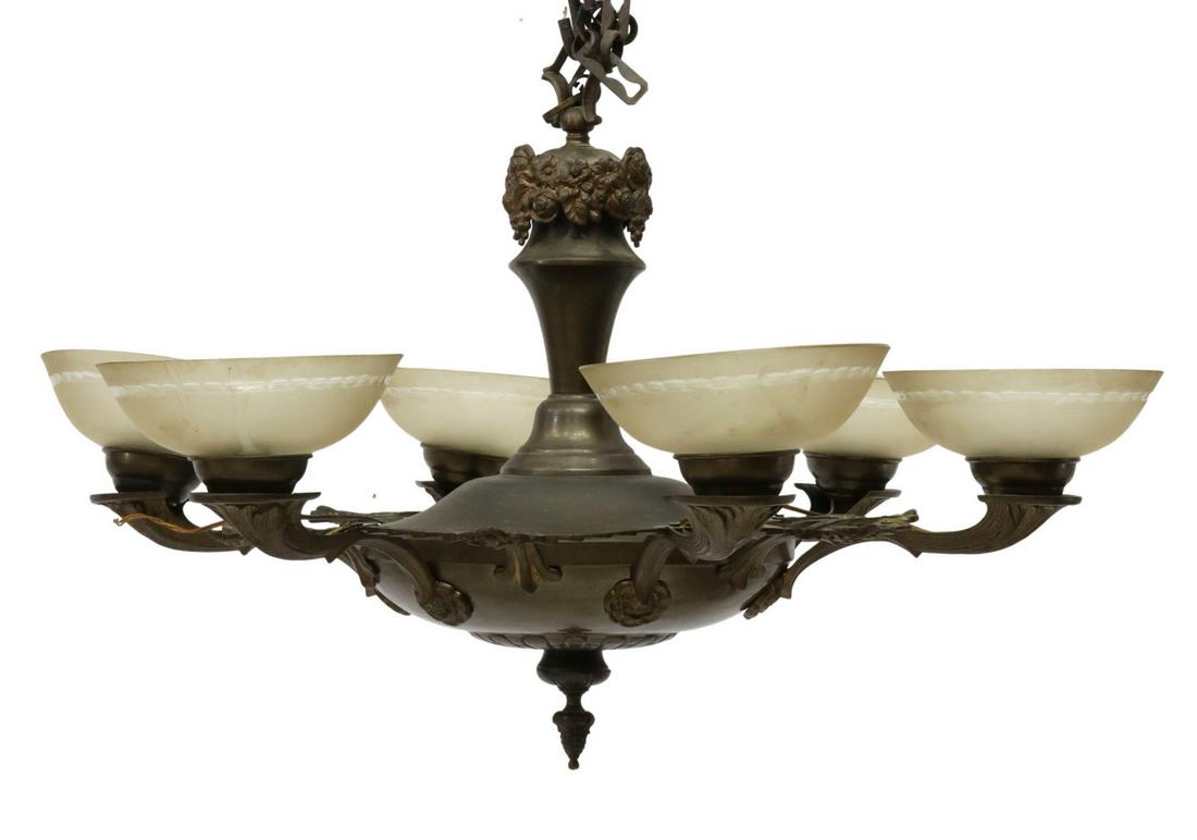 FRENCH ART DECO METAL & GLASS SIX-LIGHT CHANDELIER: French Art Deco patinated metal six light chandelier, c.1930s, having urn-form standard, issuing six curving foliate arms, joined by floral arches, ending in frosted cut glass shades, in need of wirin