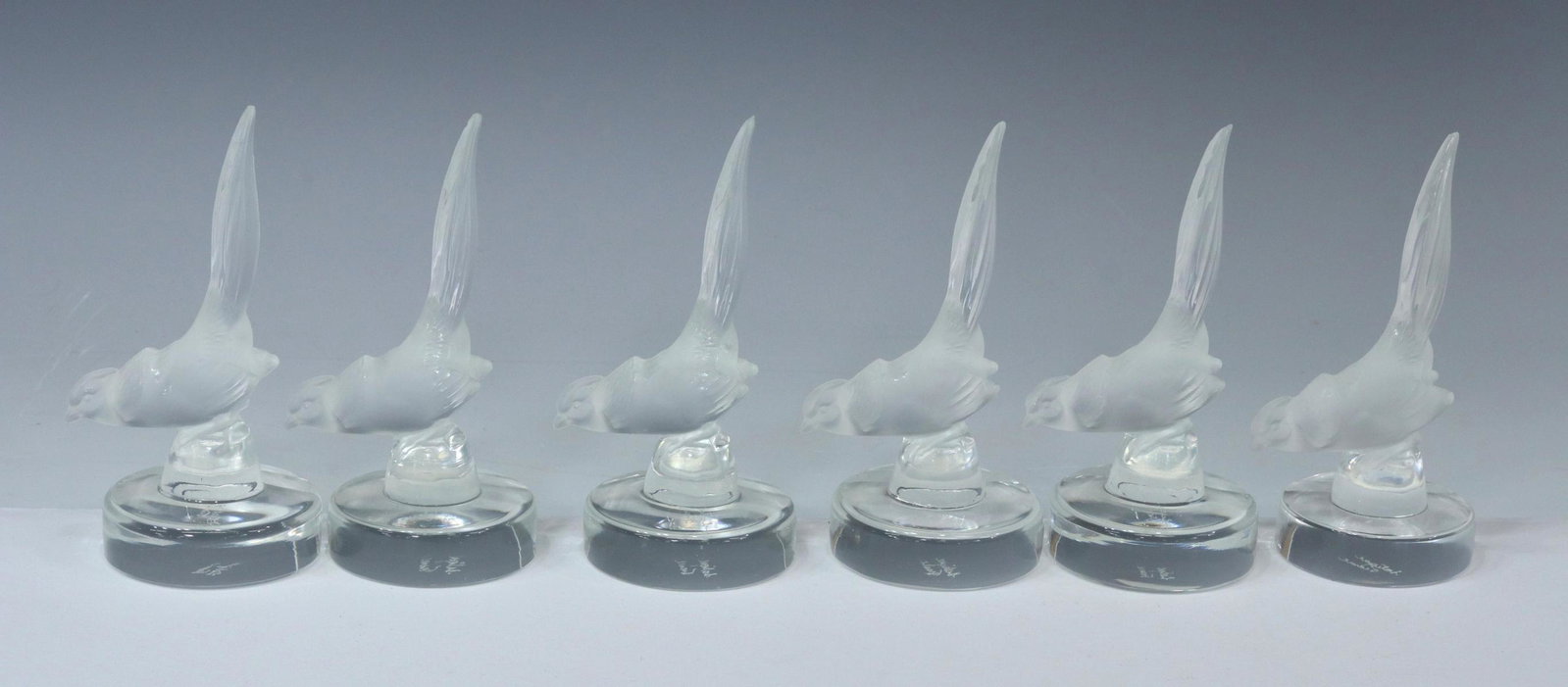 (6) LALIQUE 'FAISON' FROSTED PLACE CARD HOLDERS: (lot of 6) French Lalique art crystal "Faison" place card holders, with engraved signatures underfoot, (three) with loss to tail, approx 4.5"h, 2"diam; 2lbs total **Provenance: a Houston, Texas estate