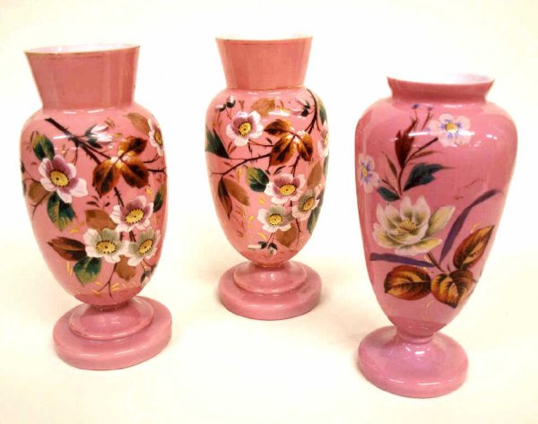 VICTORIAN PINK CASED BRISTOL GLASS MANTLE VASES: (lot of 3) Victorian bristol glass mantle vases with hand gilding and painted floral motifs: (1) pair cased white to pink pedestal vases hand gilded and painted with flowering trees, minor rim chips a