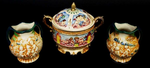 CAPODIMONTE STYLE PORCELAIN BOX, SMALL VASES: (lot of 3) Capodimonte style porcelain objects, Japan: (1) lidded dresser box, cherubs at play along body and lid, gilded scroll handles, restoration to handles, artichoke finial, some loss/cracking t