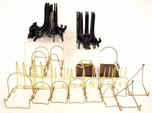 (38) WOOD & TWISTED WIRE PLATE STAND GROUPING: (lot of 38) Collection plate stands of varying sizes comprising: (12) black wood, (22) twisted gold tone metal, (2) plastic; together with (2) wood display stands, 6.5"l, 5.5."w; 9lbs total
