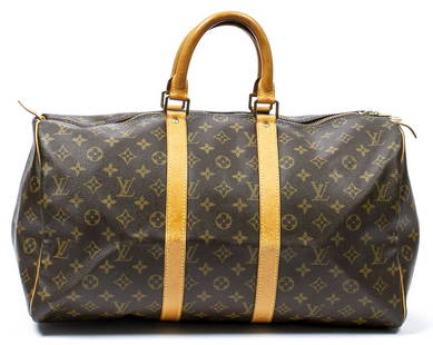 Sold at Auction: Louis Vuitton Sac Souple 45 Travel Bag, in a monogram  coated canvas, with vachetta leather accents and golden brass hardware, in  a b