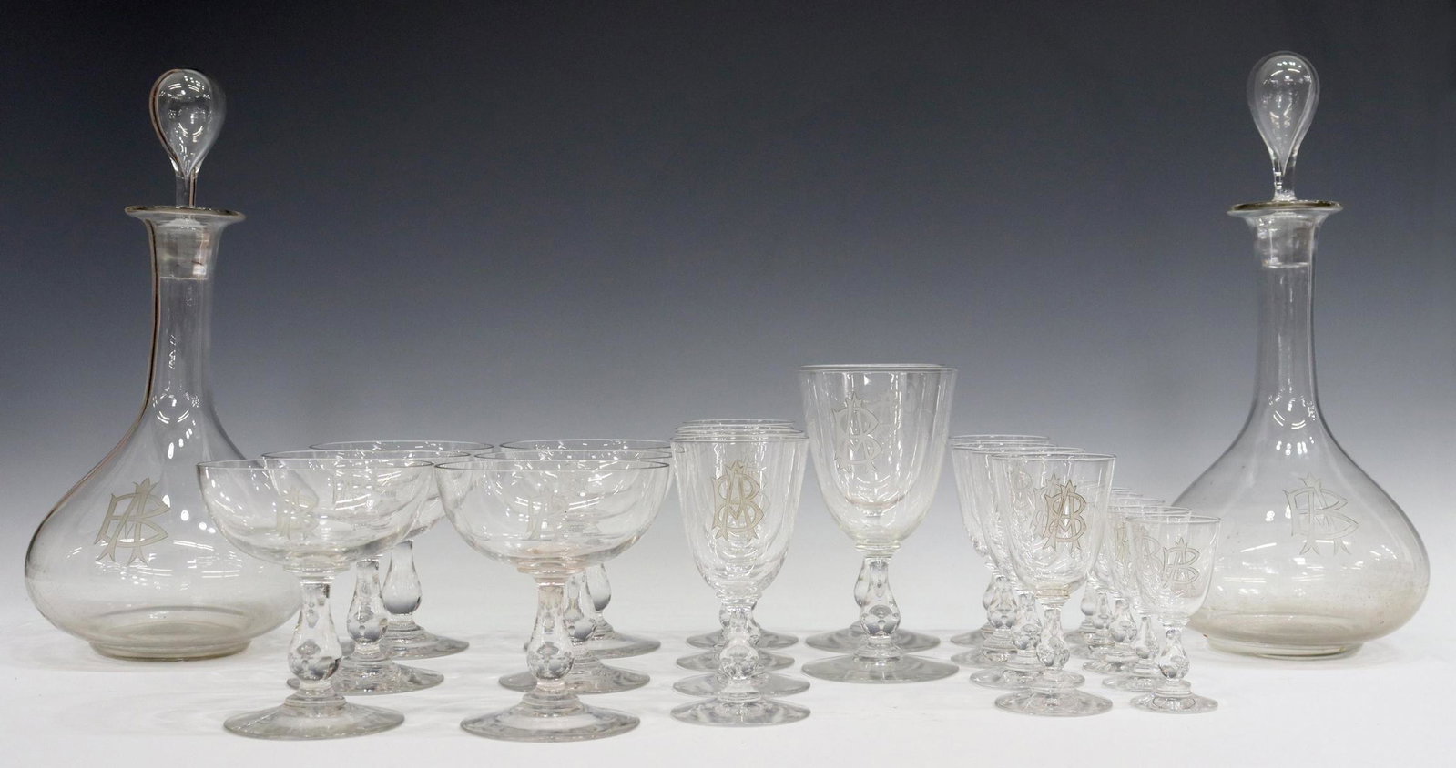 (23) FRENCH CRYSTAL STEMWARE & DECANTERS: (lot of 23) French crystal stemware, tapered bowl with etched AB monogram, baluster-form stem, on a circular foot, including: (6) champagne coupes, 4 3/8"h, 3 7/8"diam, (2) claret wine stems, 5 7/8"h,