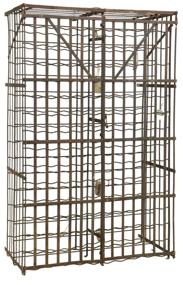 FRENCH IRON WINE CELLAR RACK CAGE: French iron wine cage/ rack, early 20th c., open iron strap construction, hinged doors with hasp, wall-mounting brackets, approx 64.5"h, 40.5"w, 22"d Start Price: $300.00