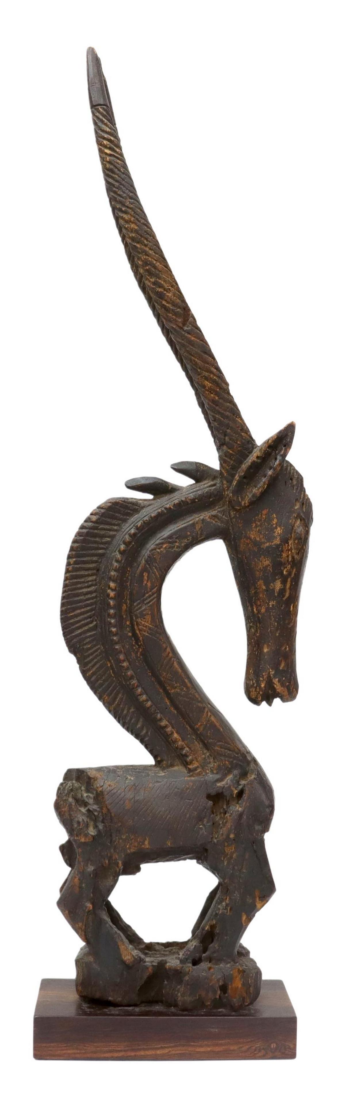 AFRICAN TRIBAL MALI CHI WARRA ANTELOPE CARVING: African carved Chi Warra antelope caving, Bamana people, Mali, carved in the vertical style, having pierced ears, geometric patterns on neck, presented on rectangular wood base, with some wood loss, o