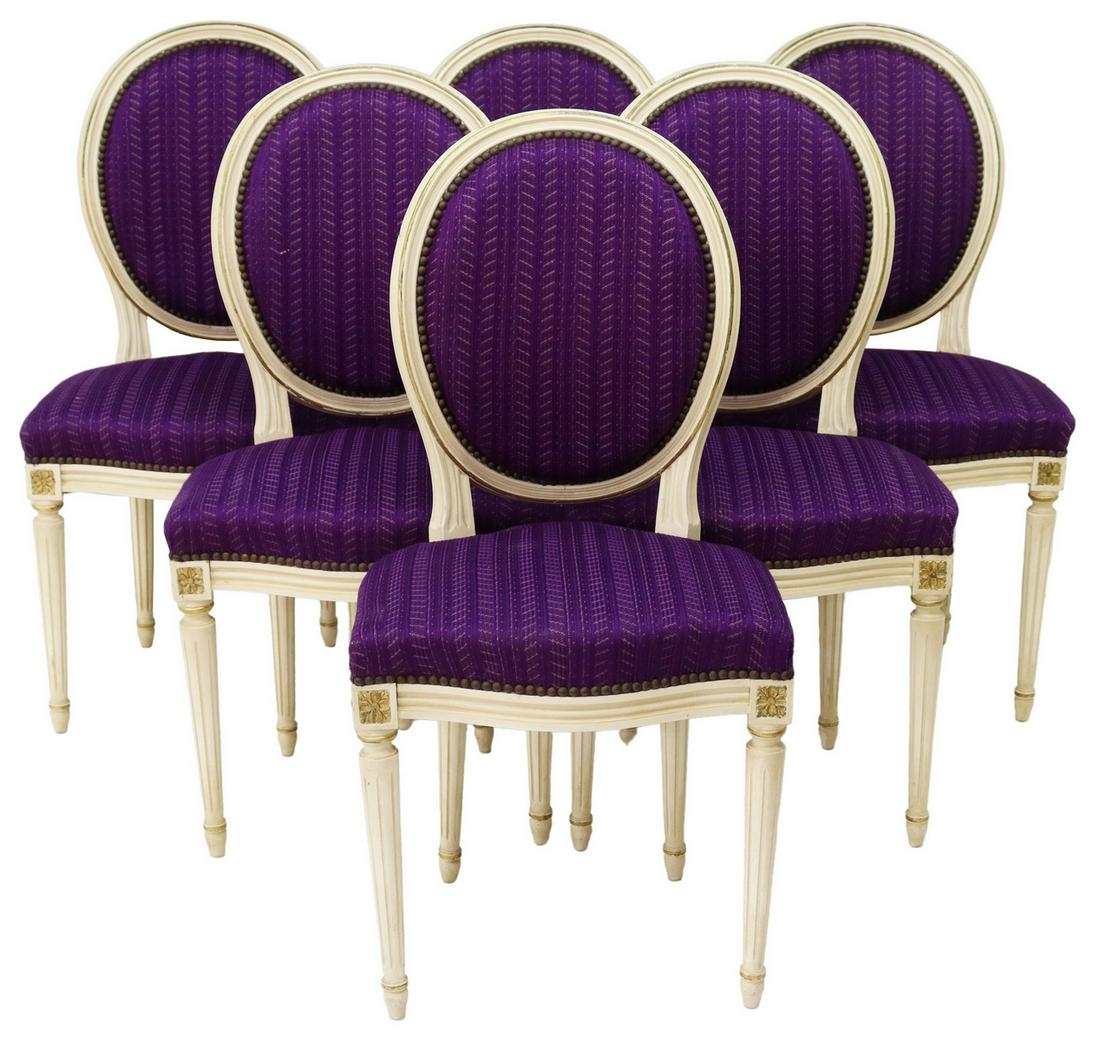 (6) FRENCH LOUIS XVI STYLE PAINTED DINING CHAIRS: (lot of 6) French Louis XVI style dining chairs, 20th c., parcel gilt and painted frames, purple upholstered medallion back and seat, nailhead trim, carved floral medallions, rising on fluted tapered