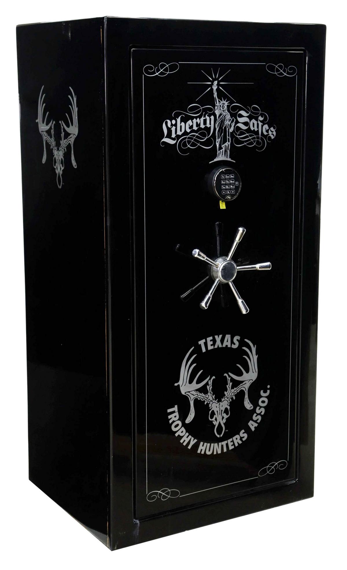 AMERICAN LIBERTY SAFE TX TROPHY HUNTERS GUN SAFE: American gun safe, Liberty Safe, 21st c., in the Presidential model, serial number 306121, having black gloss finish, decorated with the Texas Trophy Hunters Association logo, fitted with digital keyp