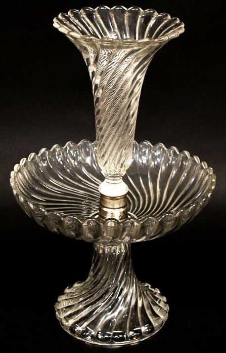 BACCARAT COLORLESS GLASS SWIRLED EPERGNE: Baccarat colorless glass epergne in swirl motif, the central trumpet raised above larger bowl further on a flared pedestal foot, acid etched mark underfoot, 15.25"h, 10"d, 6lbs