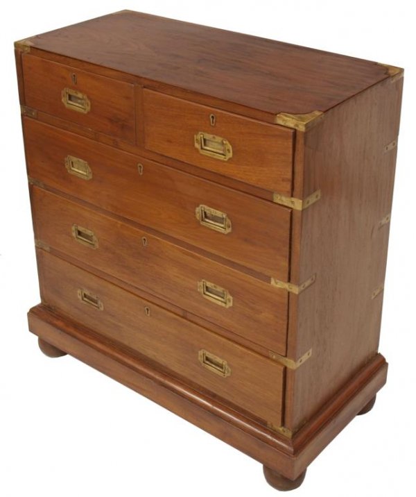ANTIQUE BRITISH COLONIAL TEAKWOOD CAMPAIGN CHEST: British Colonial teakwood campaign chest, 19th c., the diminutive case with brass bindings and inset campaign pulls resting on a straight base raised on bun feet, 33"h, 30"w, 13"d